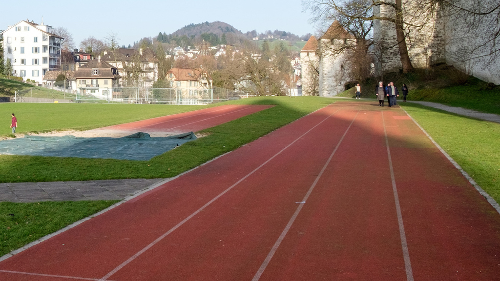 A running track with people in the background.